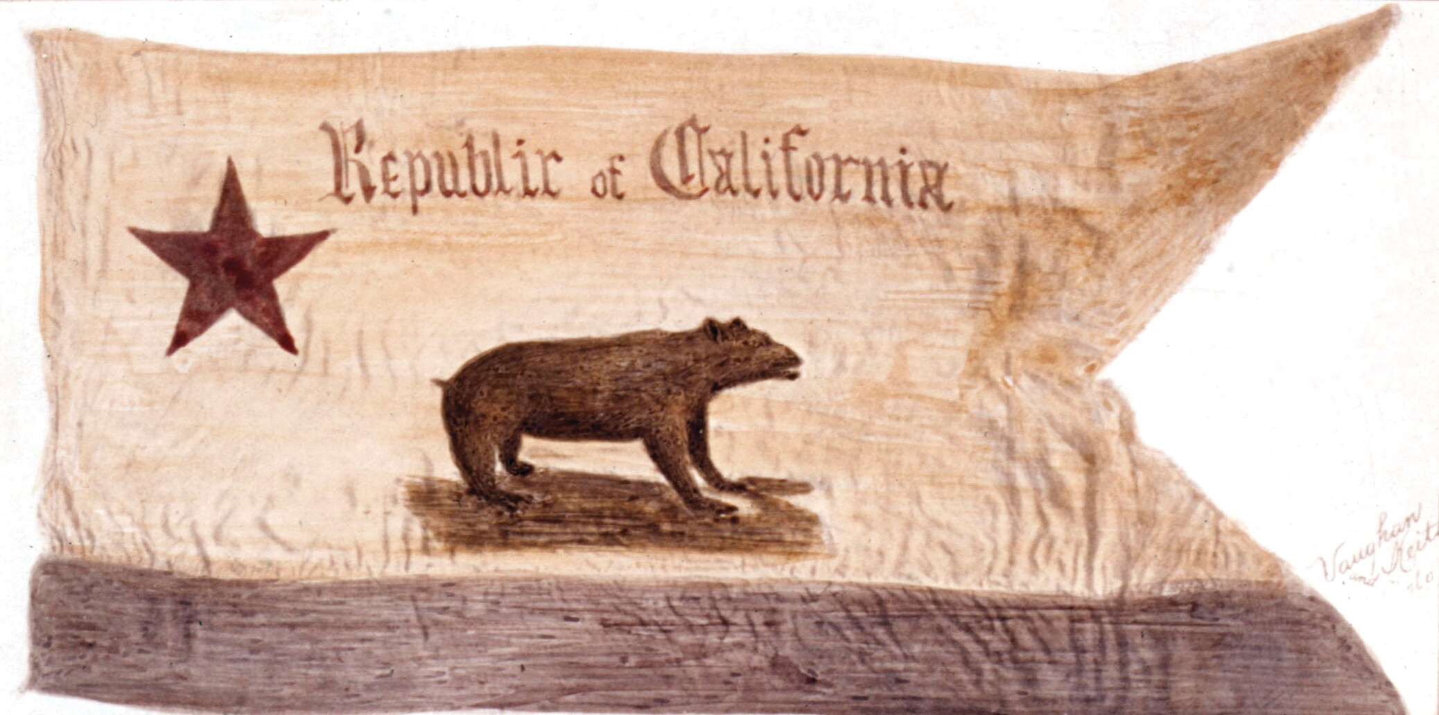 An photo of the one of the early Republic of California flags. It is rectangular with two triangular extensions from one end. A blue stripe runs across the bottom and the words Republic of California are at the top. A star is on the right side and a bear is in the middle.