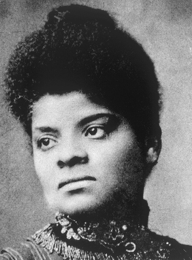 A portrait of Ida B. Wells. She has black hair pulled up on top of her head and she is wearing an ornate collar.