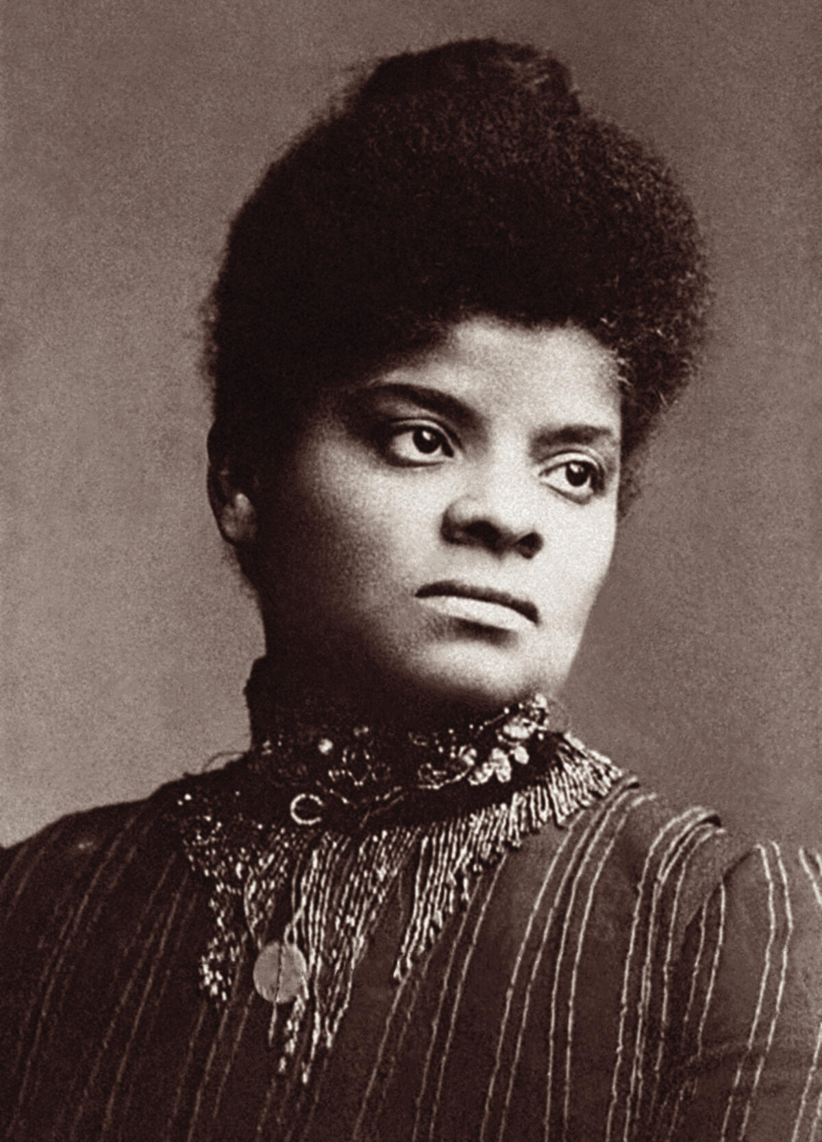 A portrait of a Black woman in a striped dress and ornate collar.