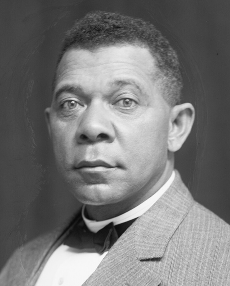 A portrait of a man in a suit and bow tie.