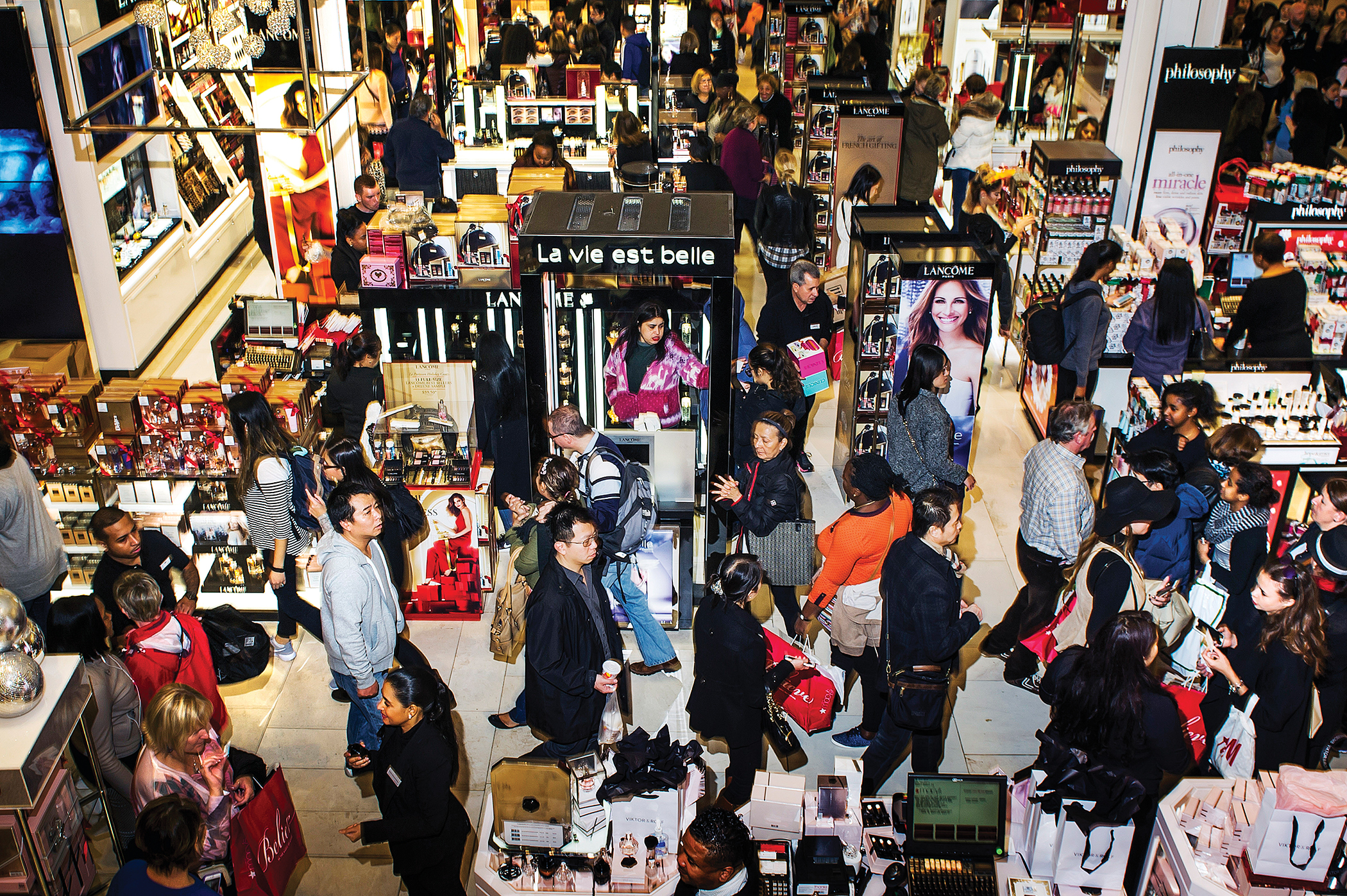 A high angle view of a department store crowded with shoppers.