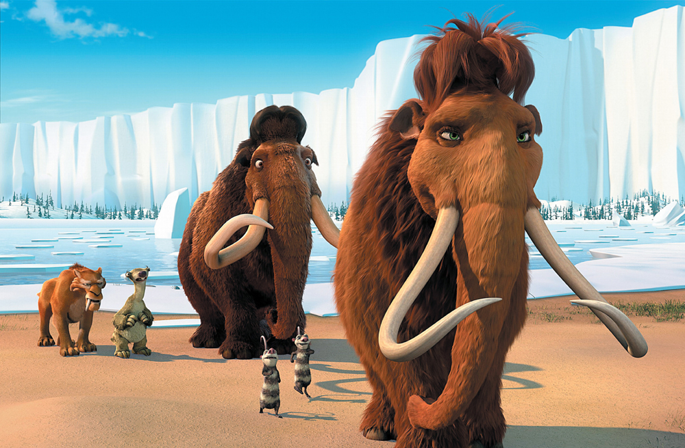 A still from the animated movie Ice Age: Continental Drift showing a pair of woolly mammoths walking along an icy shore with a few animal friends.