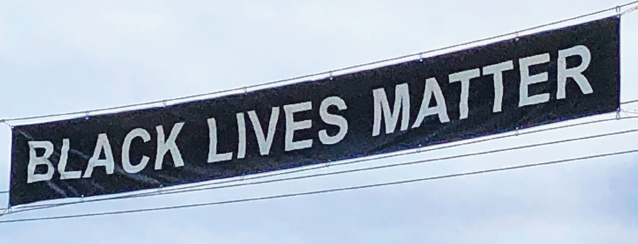 A photograph of a banner that states, “BLACK LIVES MATTER.”