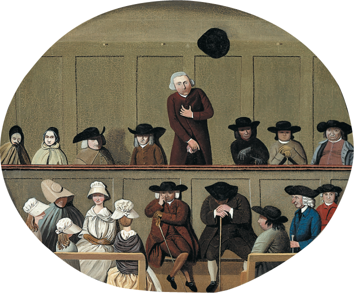 A painting of Quaker men and women at a meeting. The Quakers are seated in two rows, one above the other. A man on the top row stands, grasping at his chest.