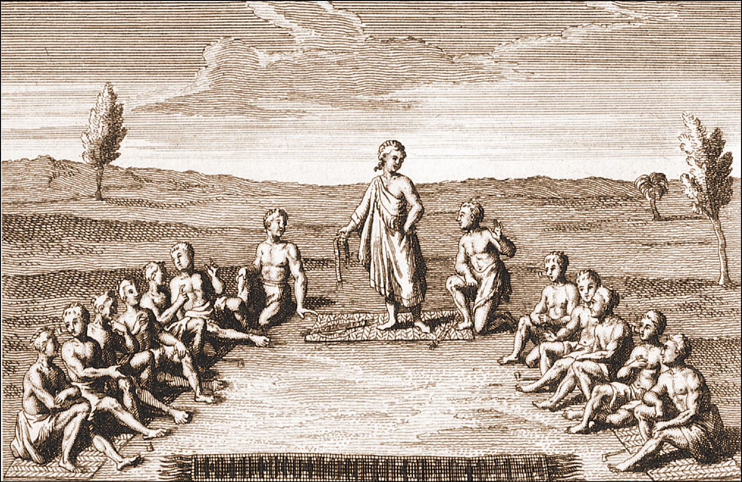 An engraving shows two rows of Indians seated upon mats on the ground facing each other with another Indian standing on a mat between them. The Indian standing between the others wears a toga and holds a wampum belt in his head. He looks down at an Indian kneeling near him. The seated Indians talk among themselves.