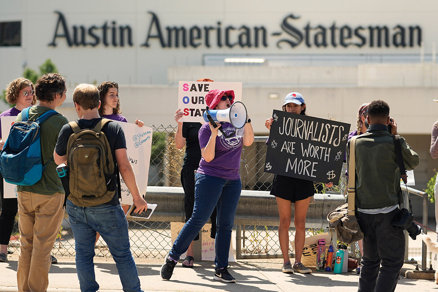 A photo shows a group of journalists on strike outside of the Austin American-Statesman.