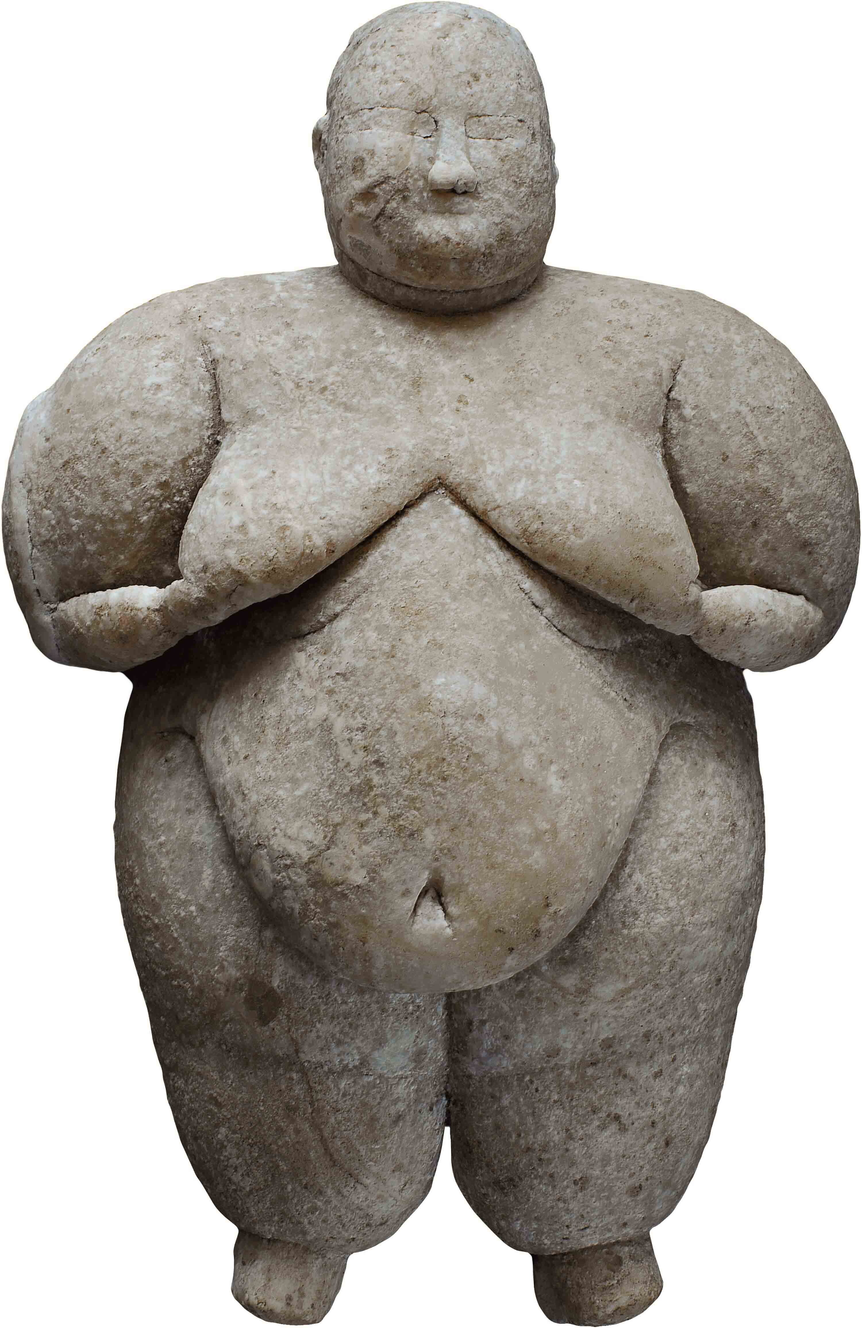 Female figure made of pale stone.