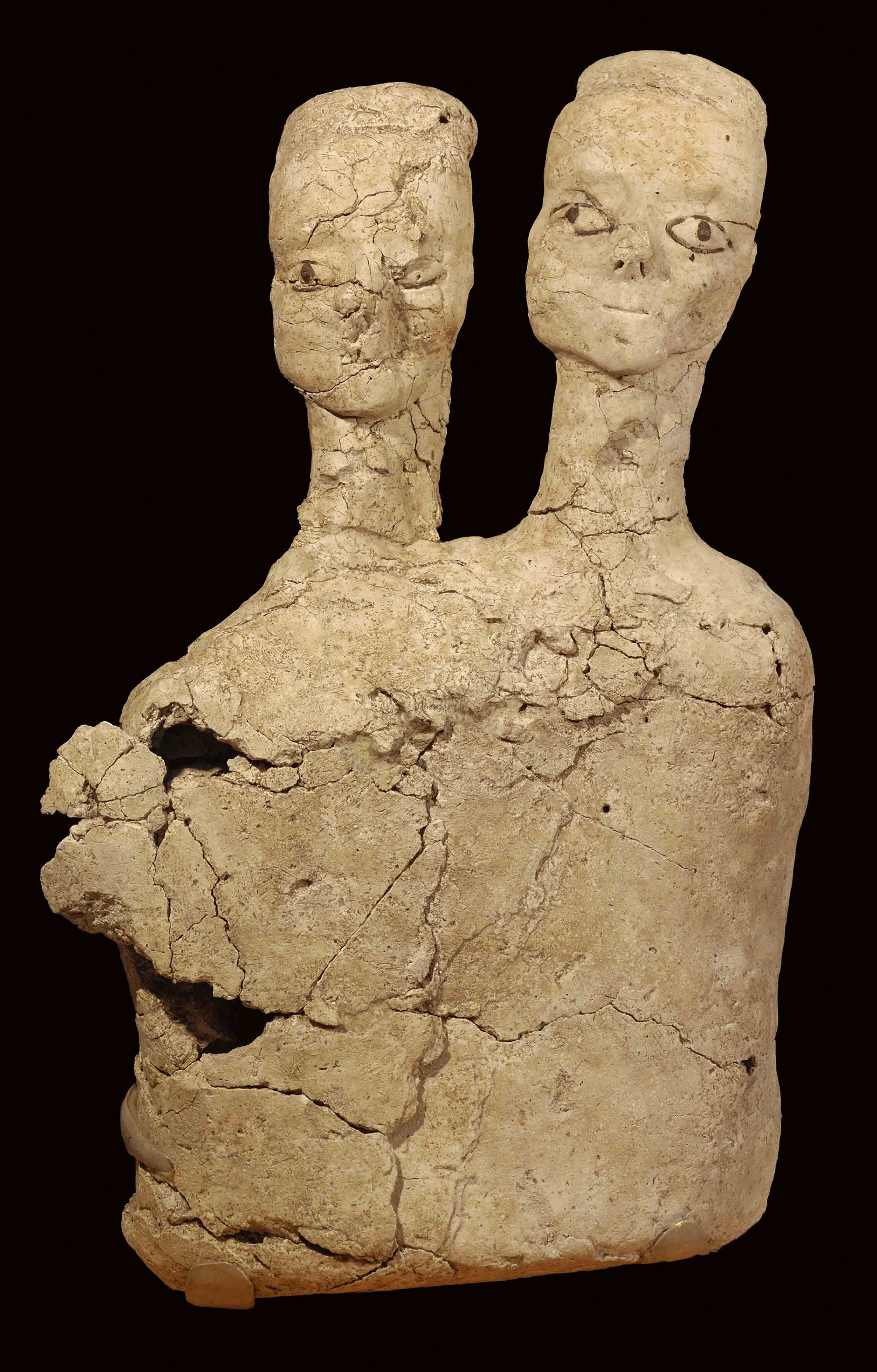 A human figurine made of pale plaster.