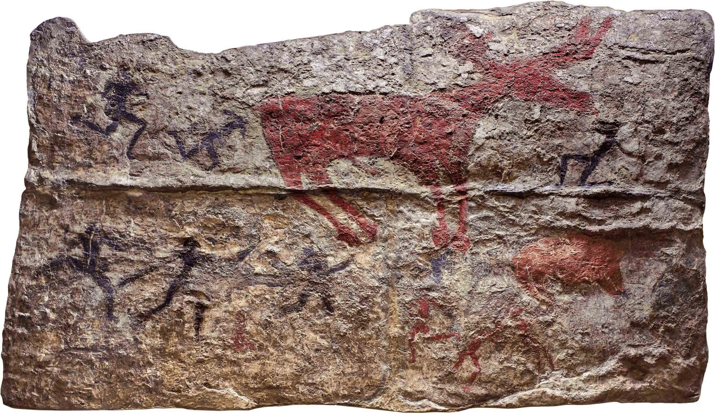 Wall painting with animals in red and people in black and red.