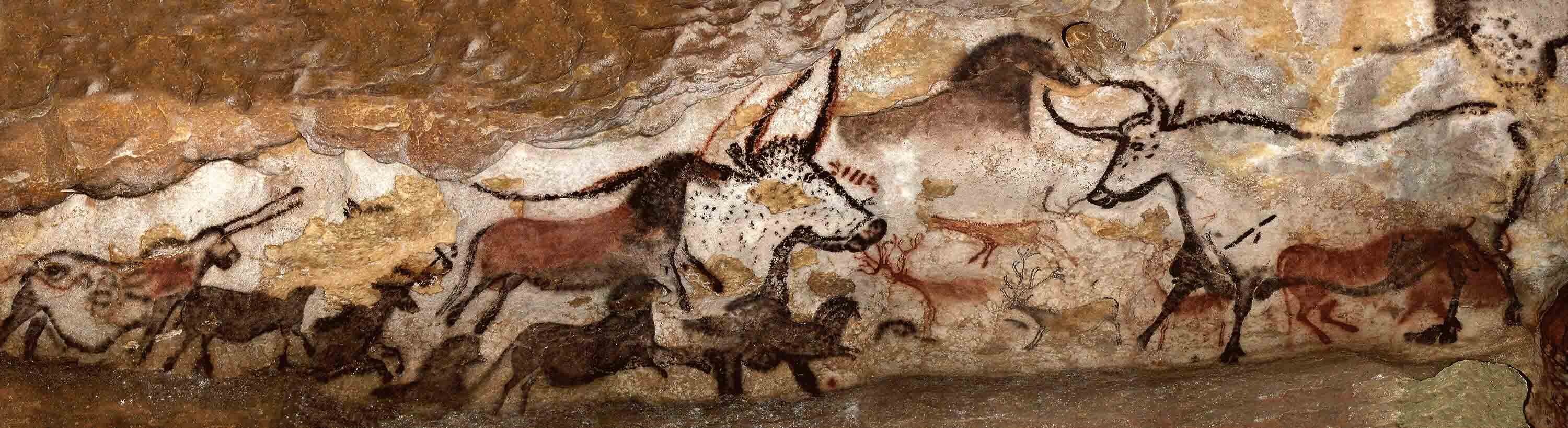 Animals painted in black and red on a pale rock background.