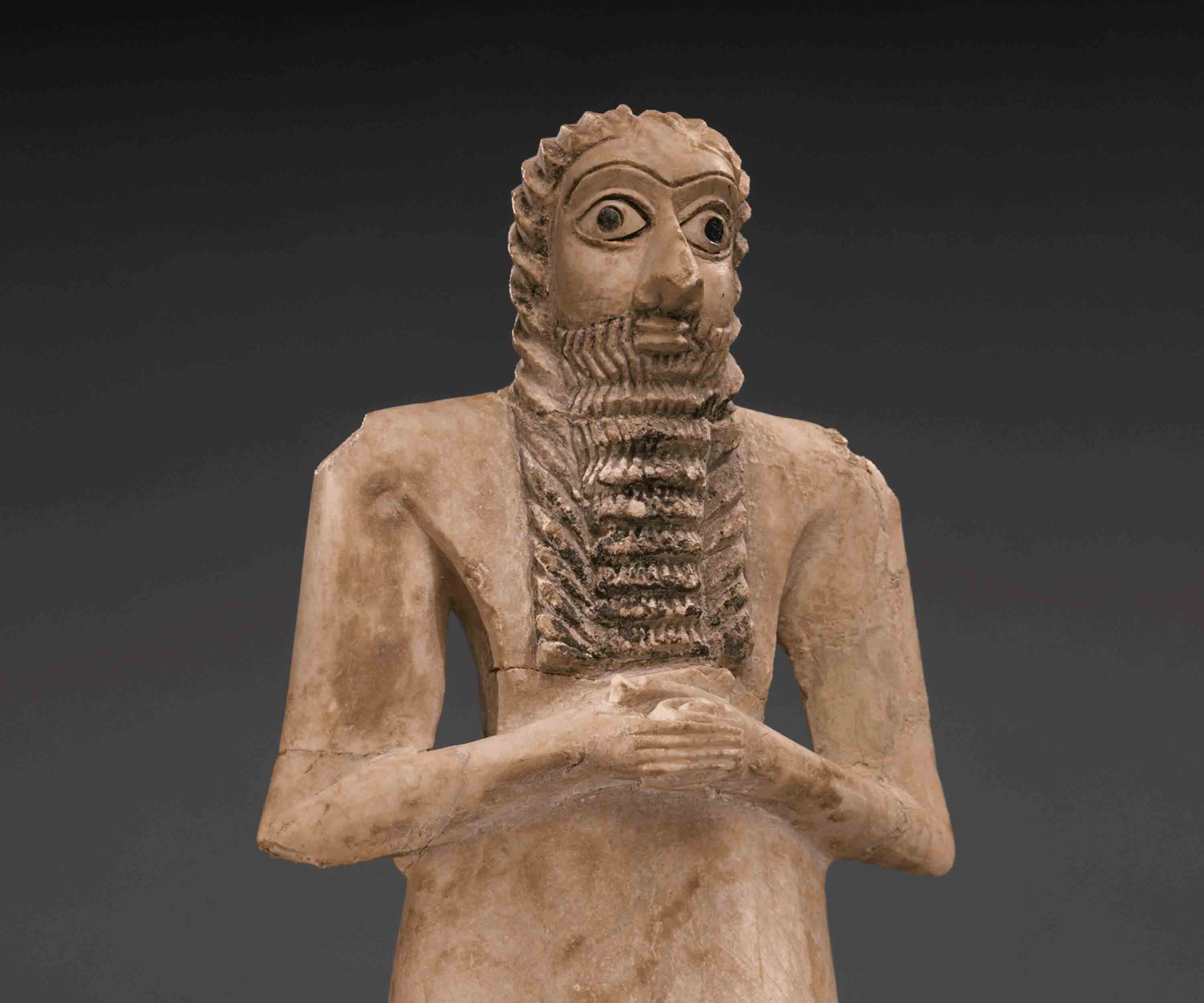 A male figure made of pale stone.