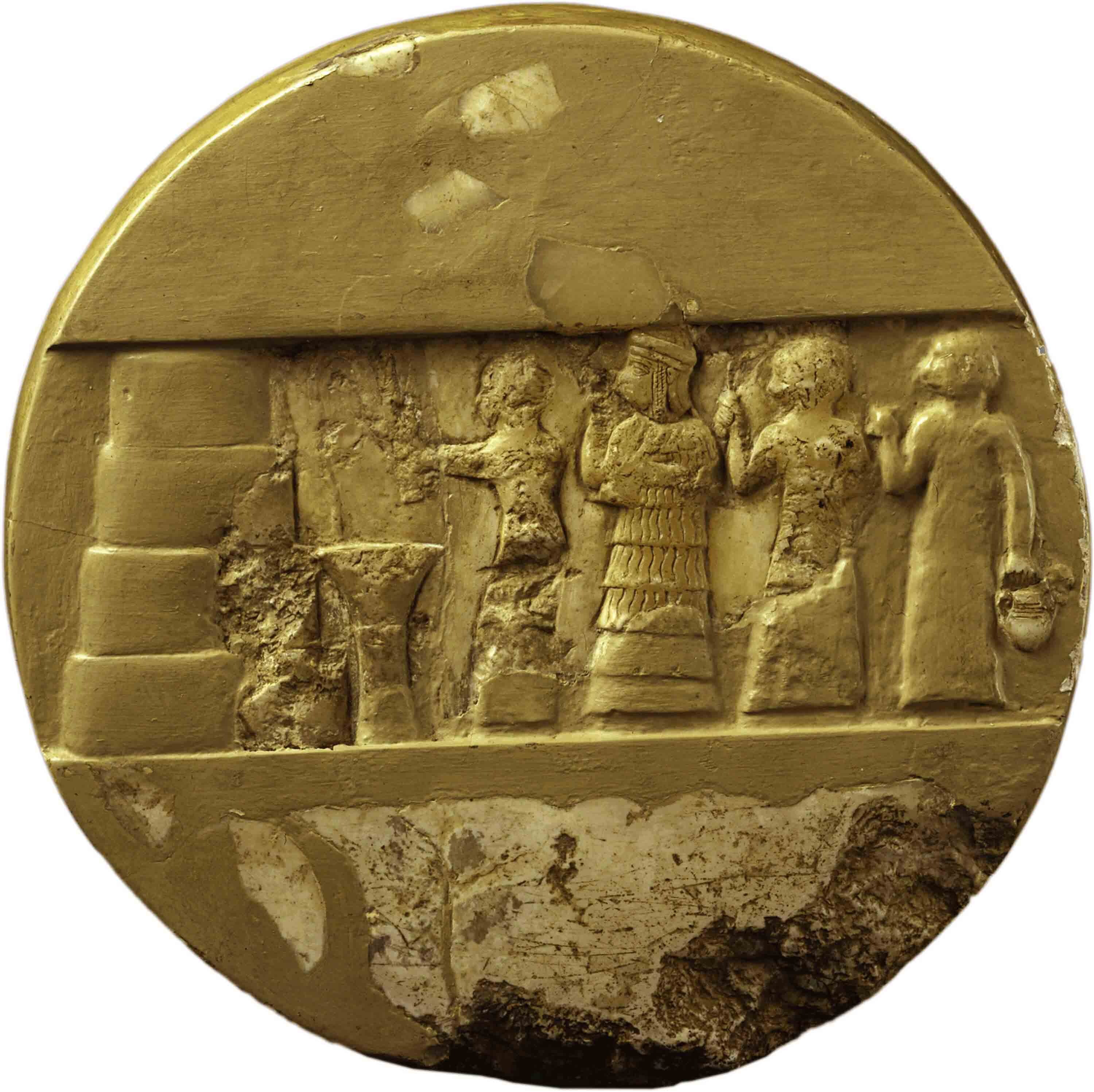 Disk made of yellow stone with a carved relief.