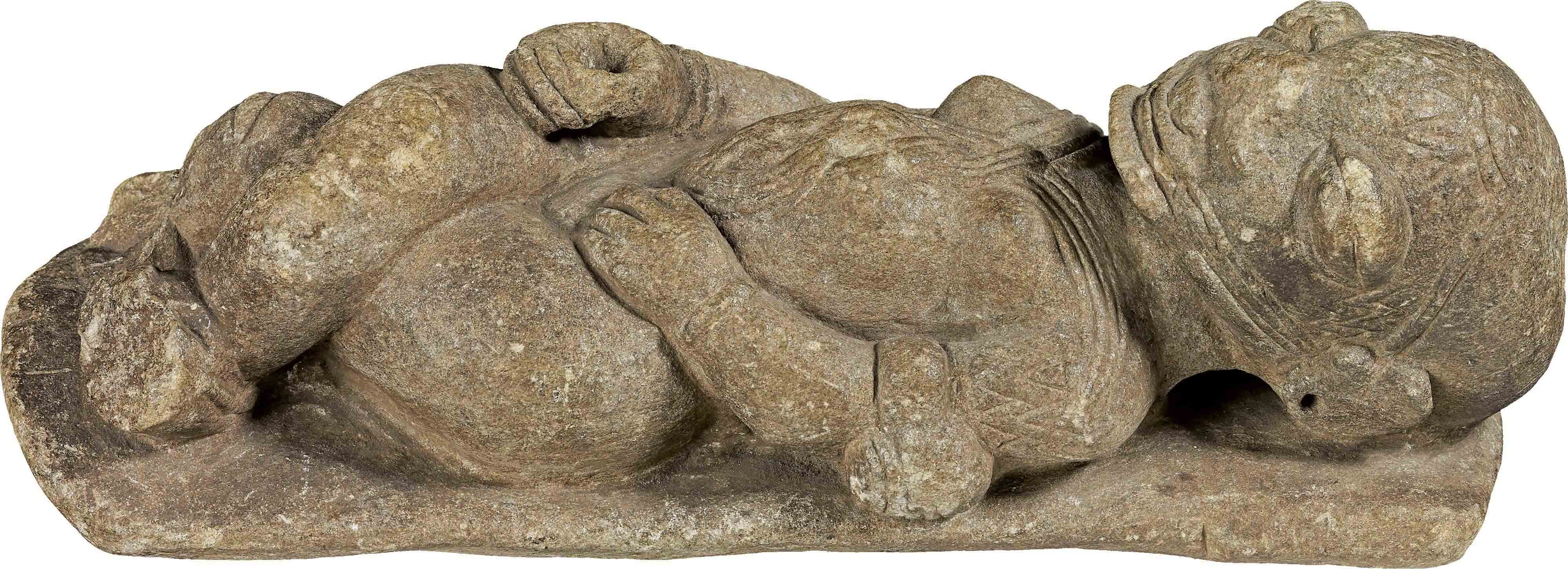 Reclining figure, carved from gray stone.