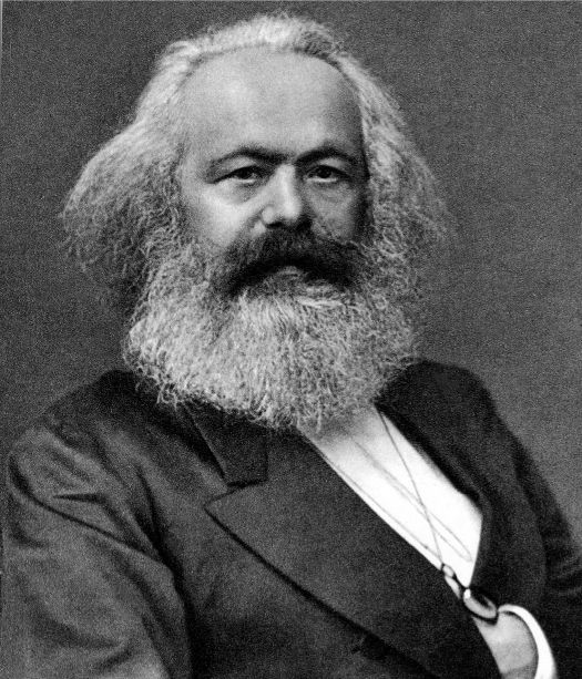 Karl Marx, a German economic, political, and social theorist, in a formal suit.