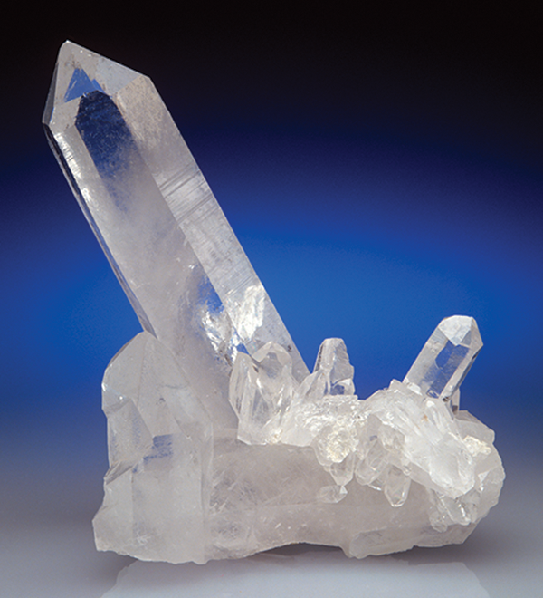 A photo shows the crystalline form of silicon dioxide, known as quartz. The caption reads, �Quartz crystal: Quartz (silicon dioxide) is the silicon analog of carbon dioxide. Whereas carbon dioxide is gaseous, silicon dioxide is a solid.�