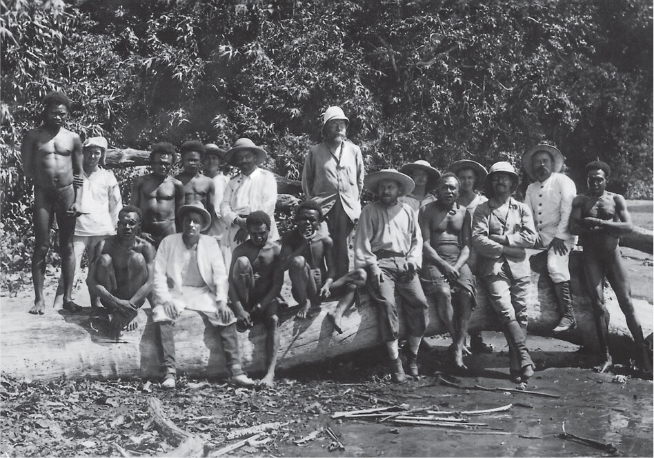 A historic photo of Robert Koch standing with a group of people in New Guinea.