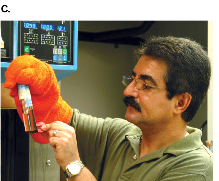 Image C is a photograph of microbiologist Kazem Kashefi holding a magnet to a sample tube of Geogemma strain 121.