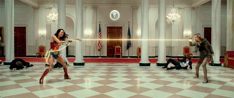 In a fight scene in Wonder Woman 1984, two women are shown on either side of a room tugging a glowing rope.