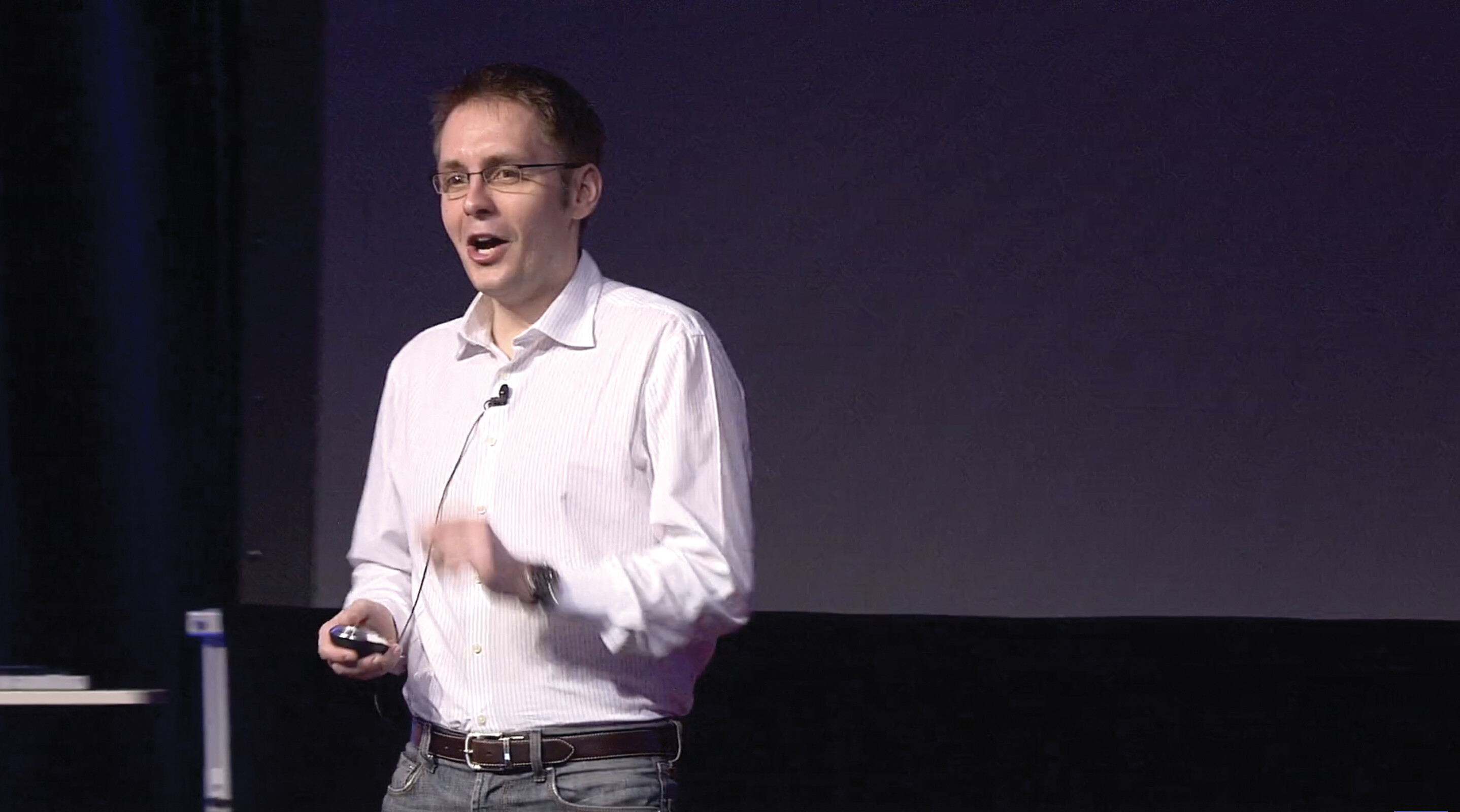 A screenshot of Sebastian Wernicke’s TED talk. He stands on a stage in an auditorium.