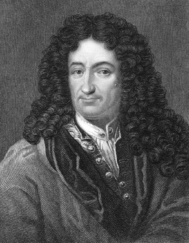 A portrait of a man with long hair and wearing a buttoned shirt.