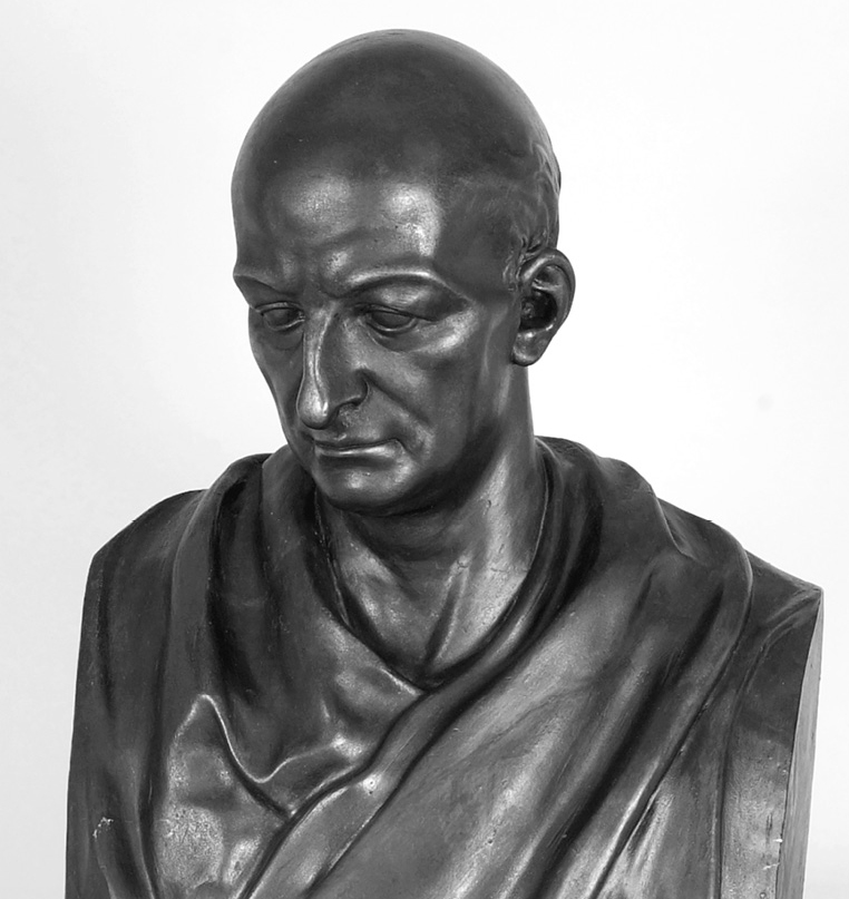 A statue of a bald headed man.