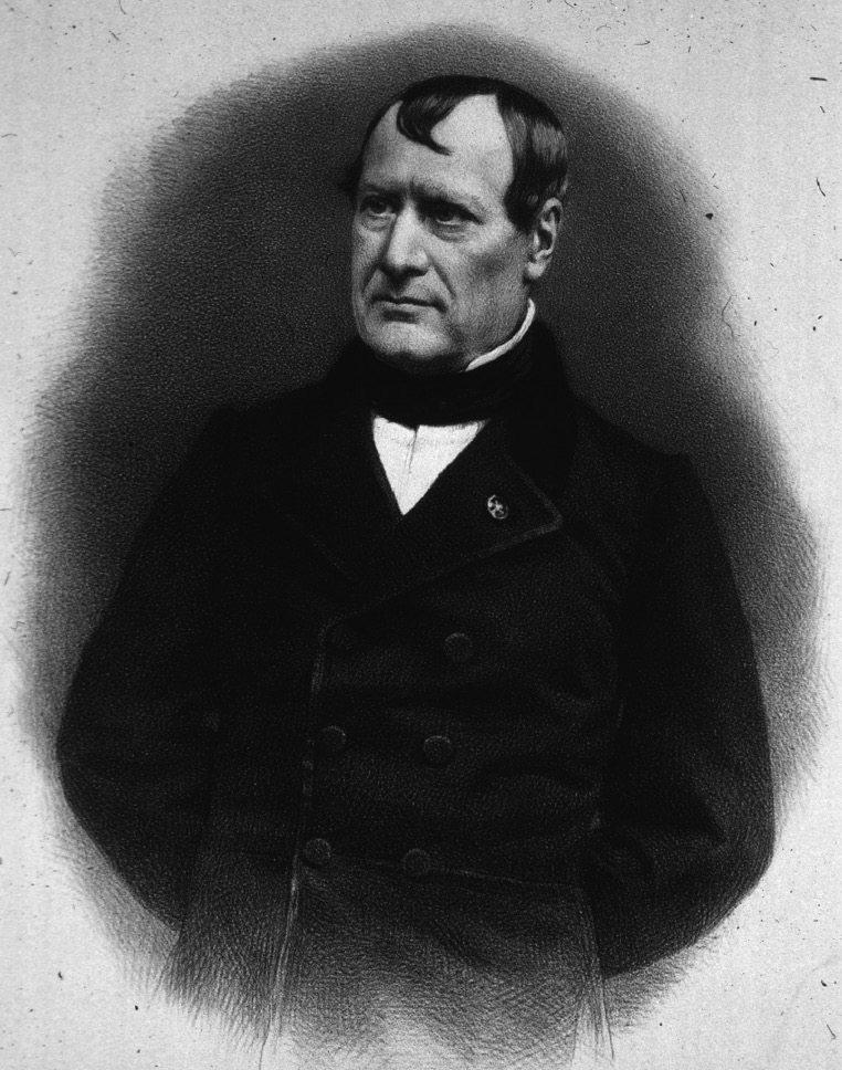 A portrait of a man wearing a buttoned coat with his hands behind his back.