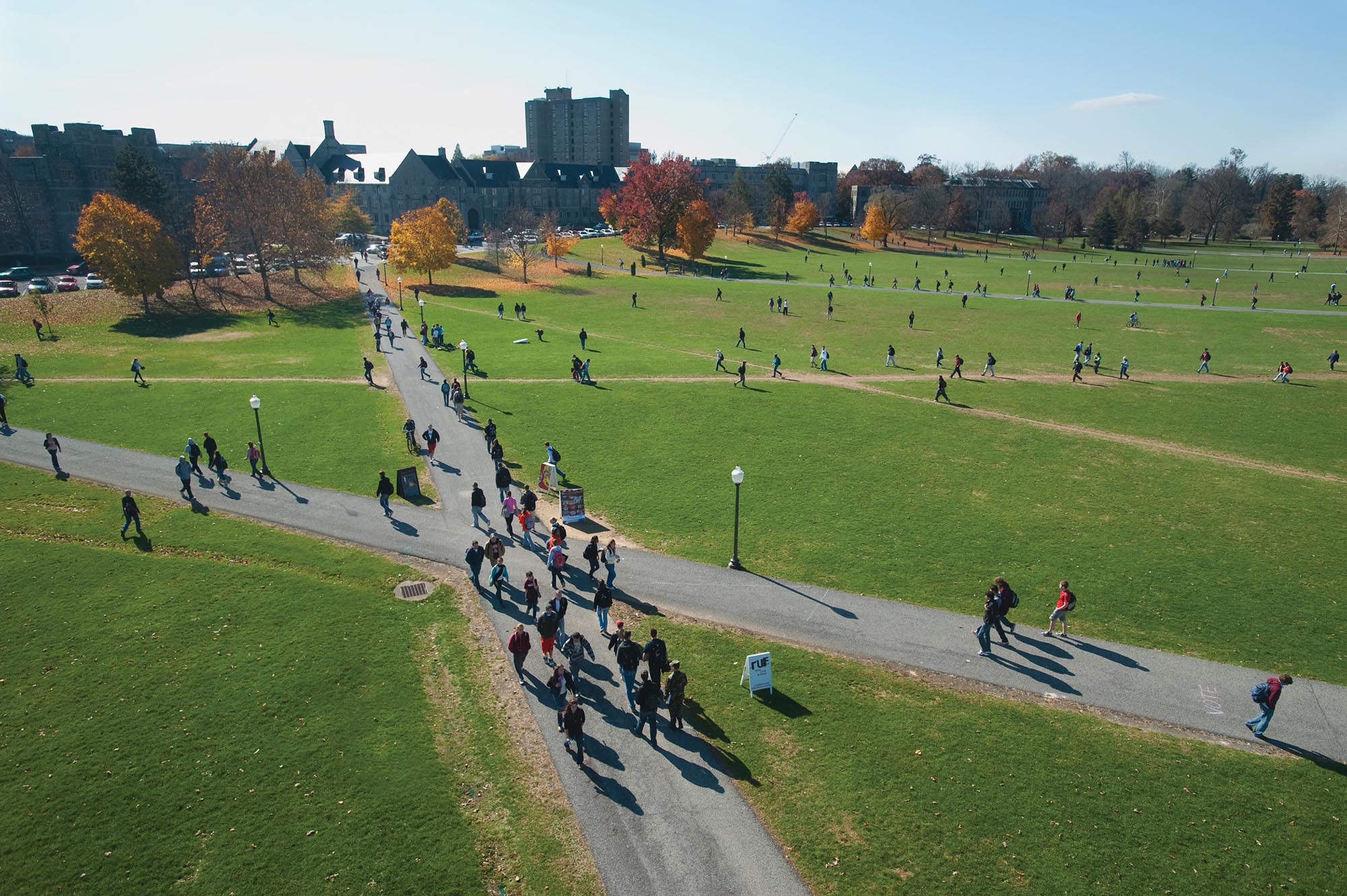 Students walking across a campus.