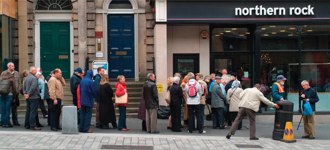 Depositors queue up outside a Northern Rock Bank.