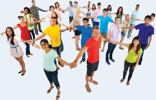 A group of smiling, young people join hands to create a web-like network.