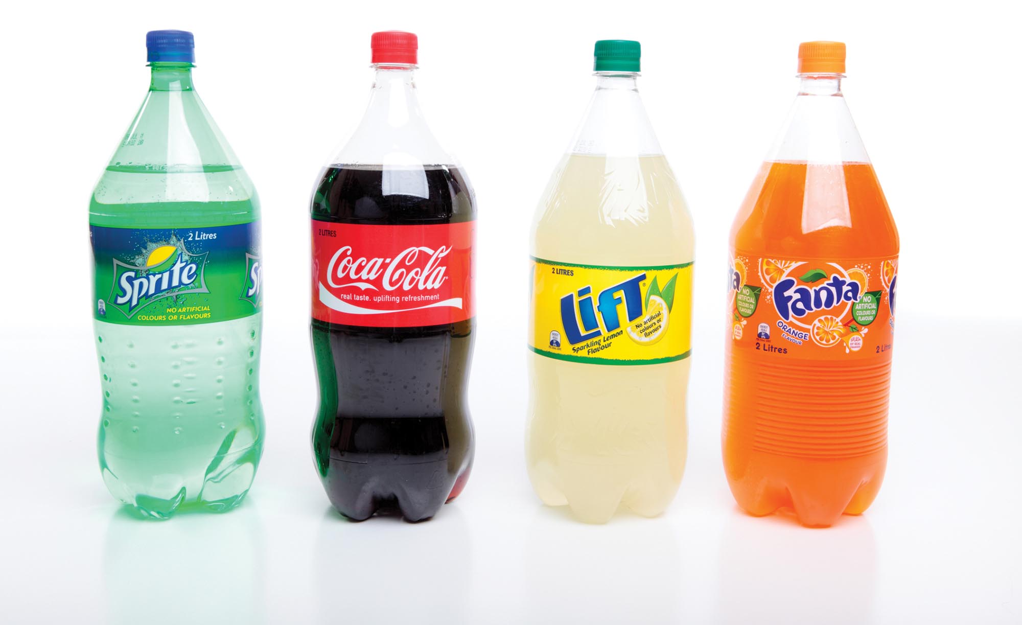 Four different brands of two-liter sodas: Sprite, Coca-Cola, Lift, and Fanta.