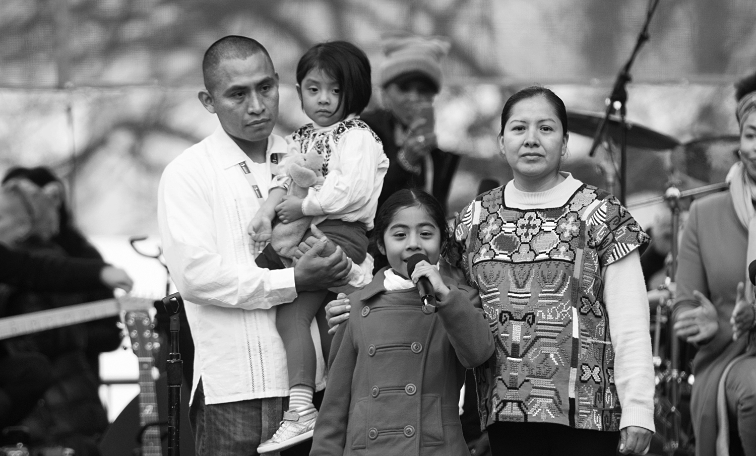 A photo shows Sophie Cruz, about seven years old, standing with her family and speaking onstage at the Women’s March on Washington in Washington, D.C.
