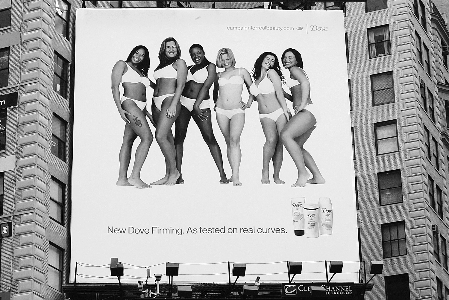 A photo shows a billboard depicting Dove’s Campaign for Real Beauty.