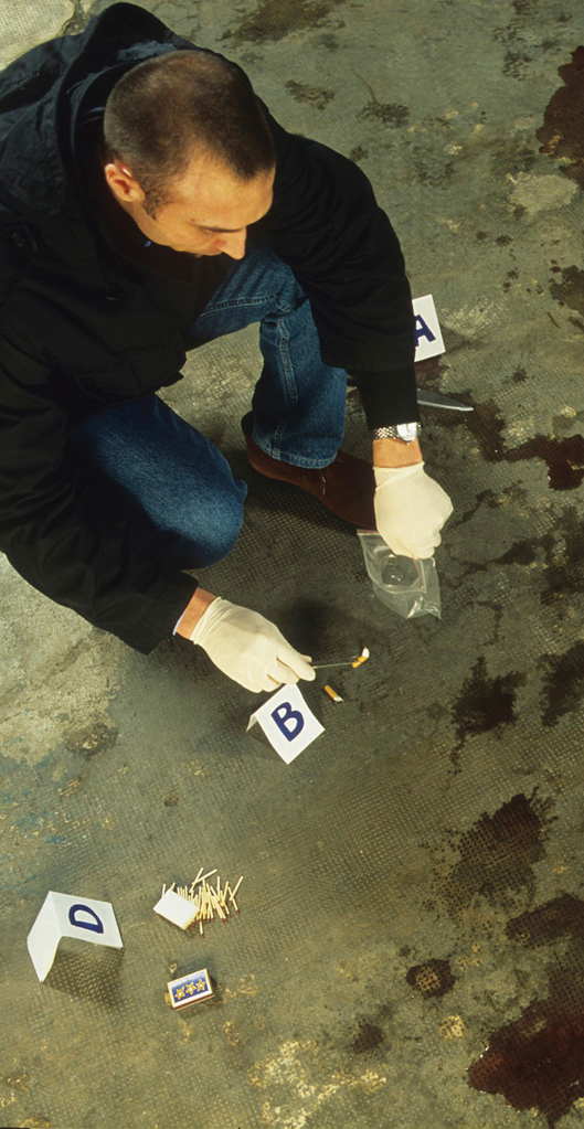 Chapter Opener. A man wearing medical gloves is taking samples from a crime scene. There are markers on the ground indicating where he has taken samples from.