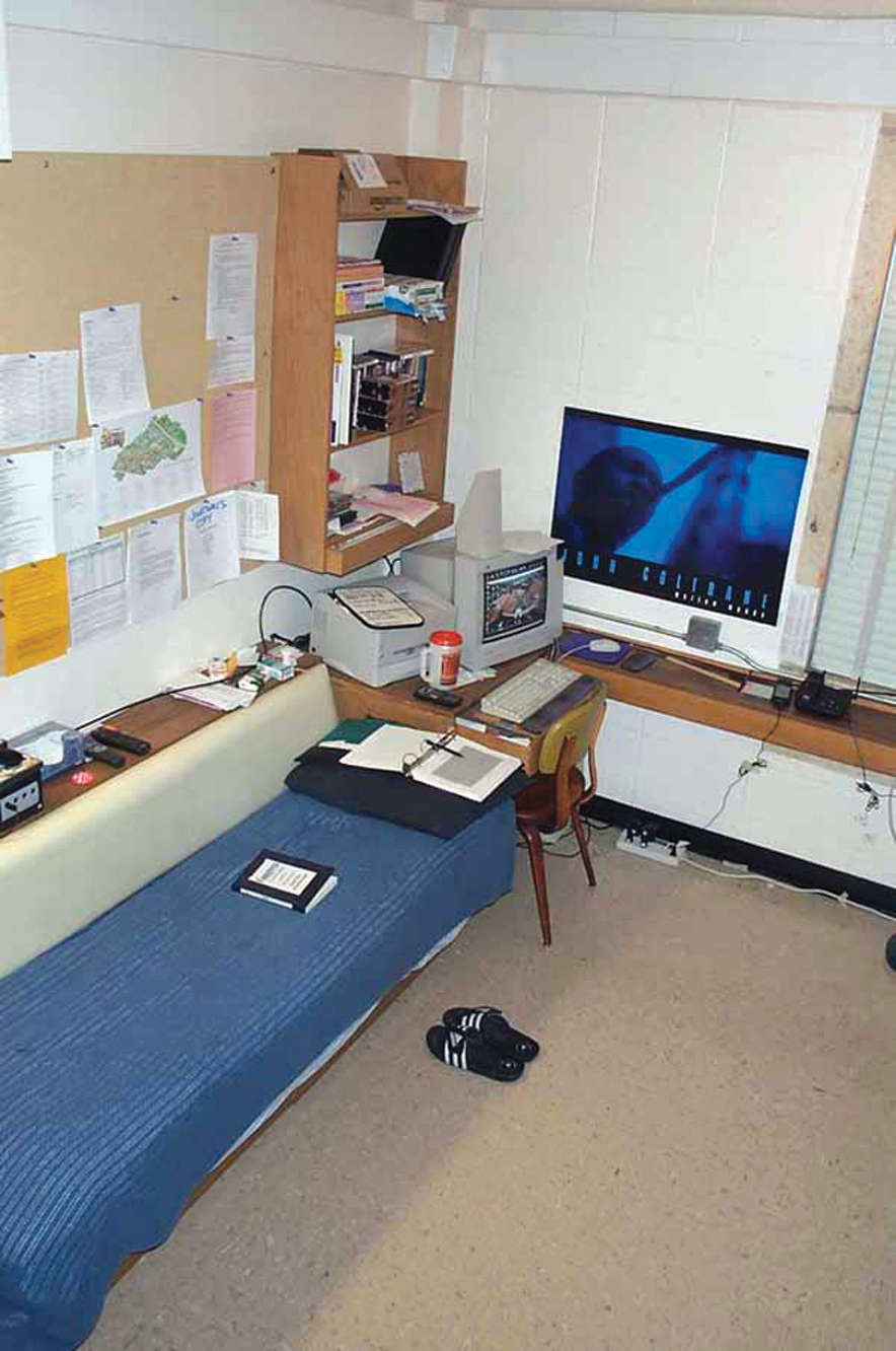 A photo shows a dorm room that is very organized and clutter free.