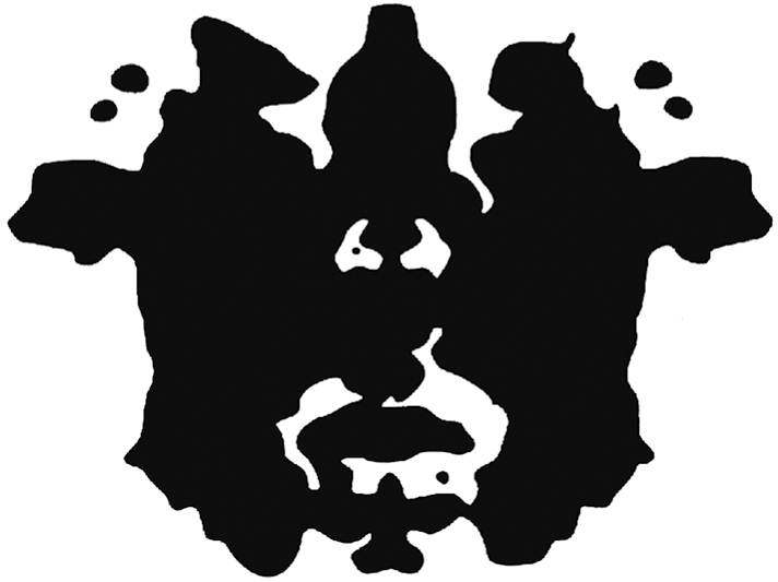 A Rorschach inkblot shows an amorphous blob of black ink, mirrored across the center.