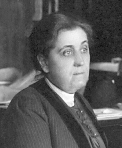 A black-and-white portrait of a white woman looking to the side.
