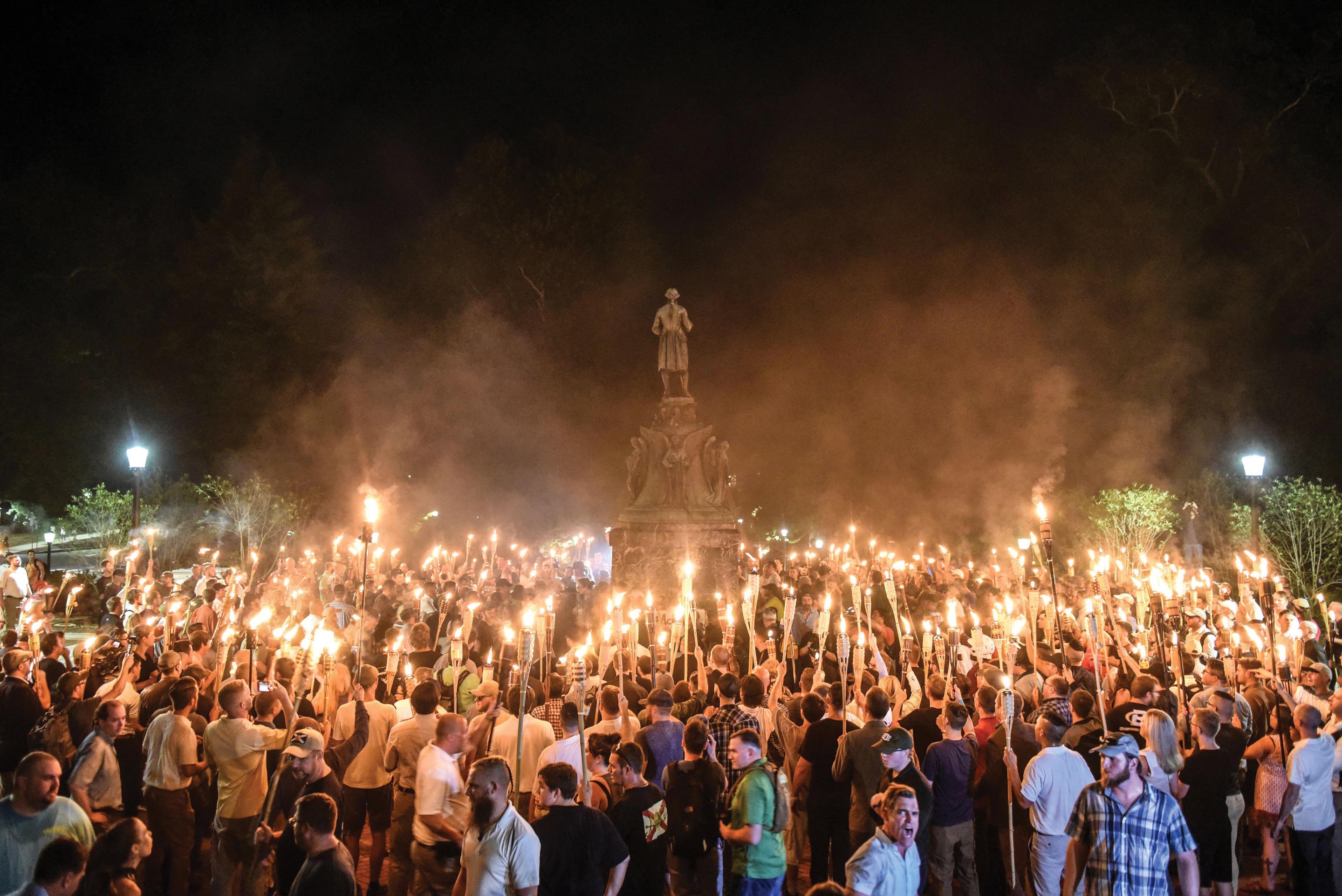 White nationalists holding candles and protesting in the University of Virginia campus.