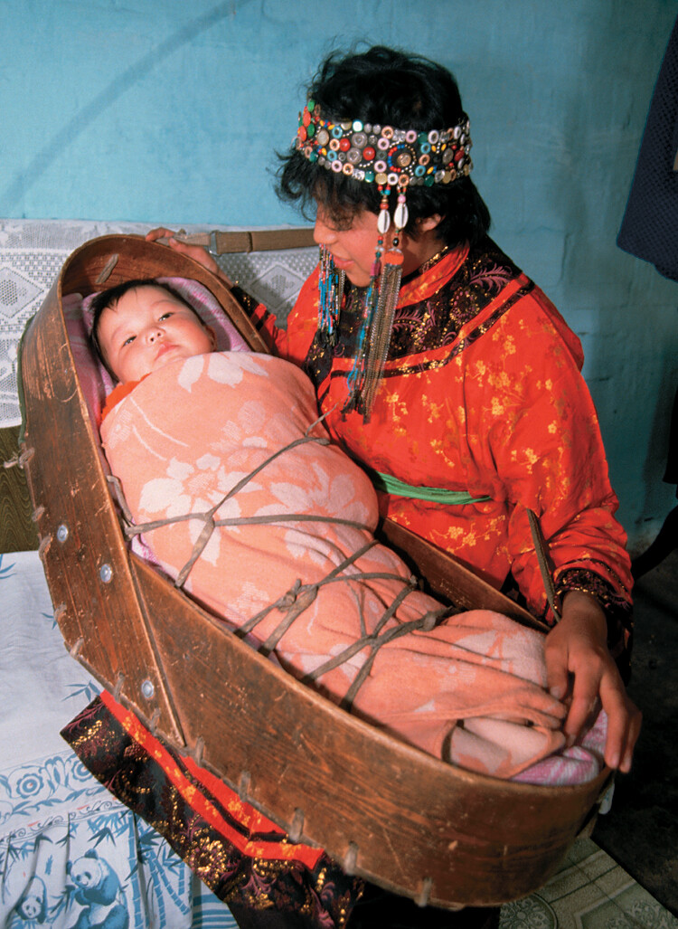 Lullabies are sung in most societies. Here a woman in Shibazhan, China, sings to her son.