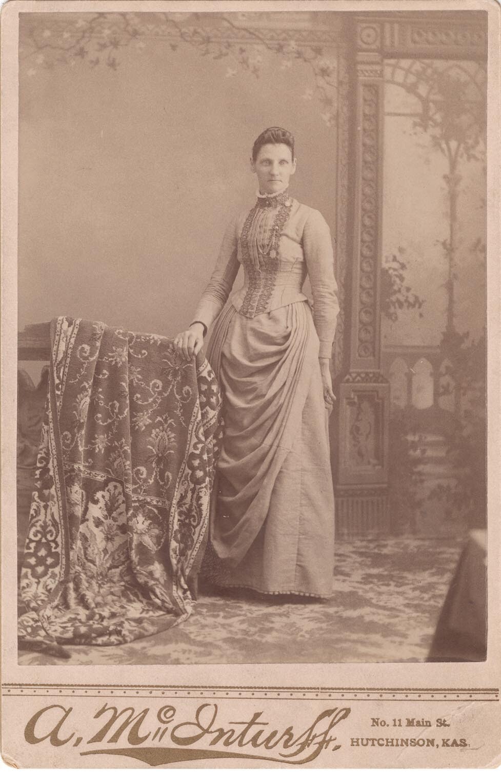A portrait of Mary Elizabeth Lease, standing.
