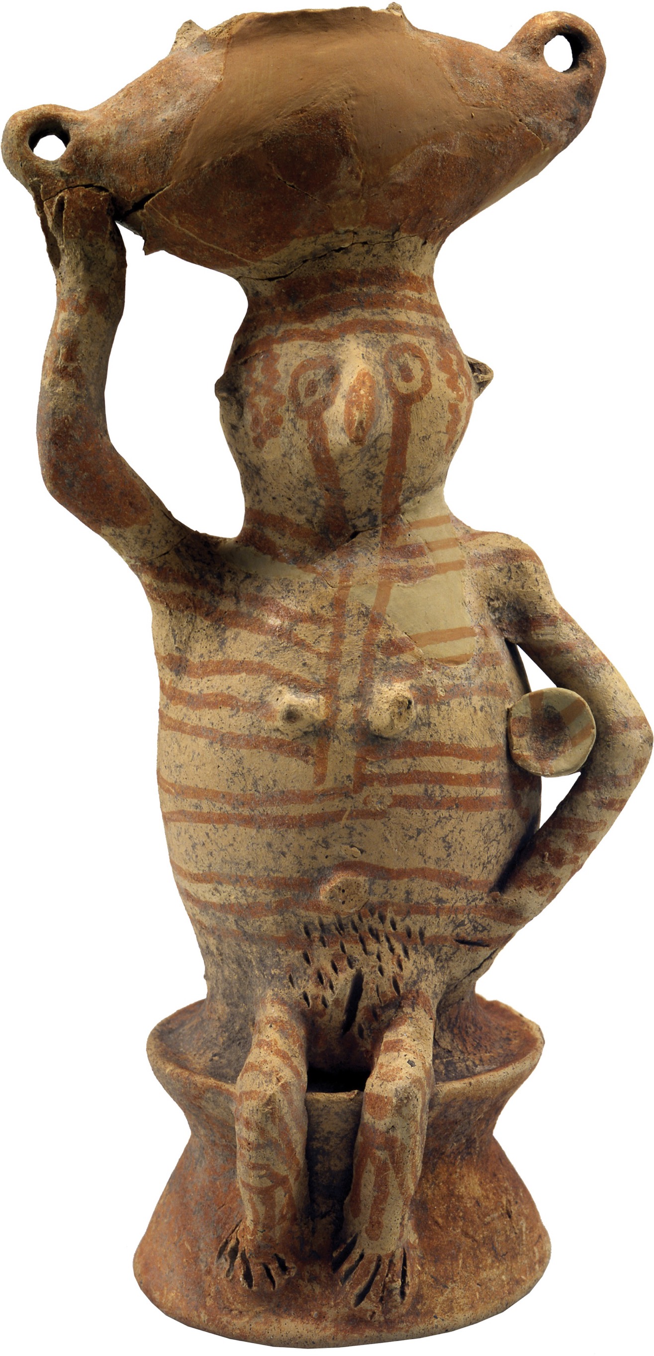 A photo shows a statue of a woman carrying a pot on her head.