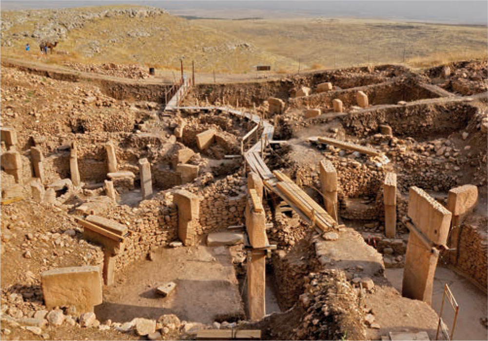 A photo shows the ruins of monumental stone buildings from the excavations at Göbekli Tepe.