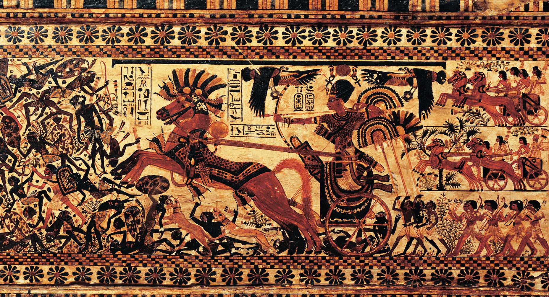 A mural of an Egyptian Pharaoh riding a chariot into a battle holding a bow and arrow.