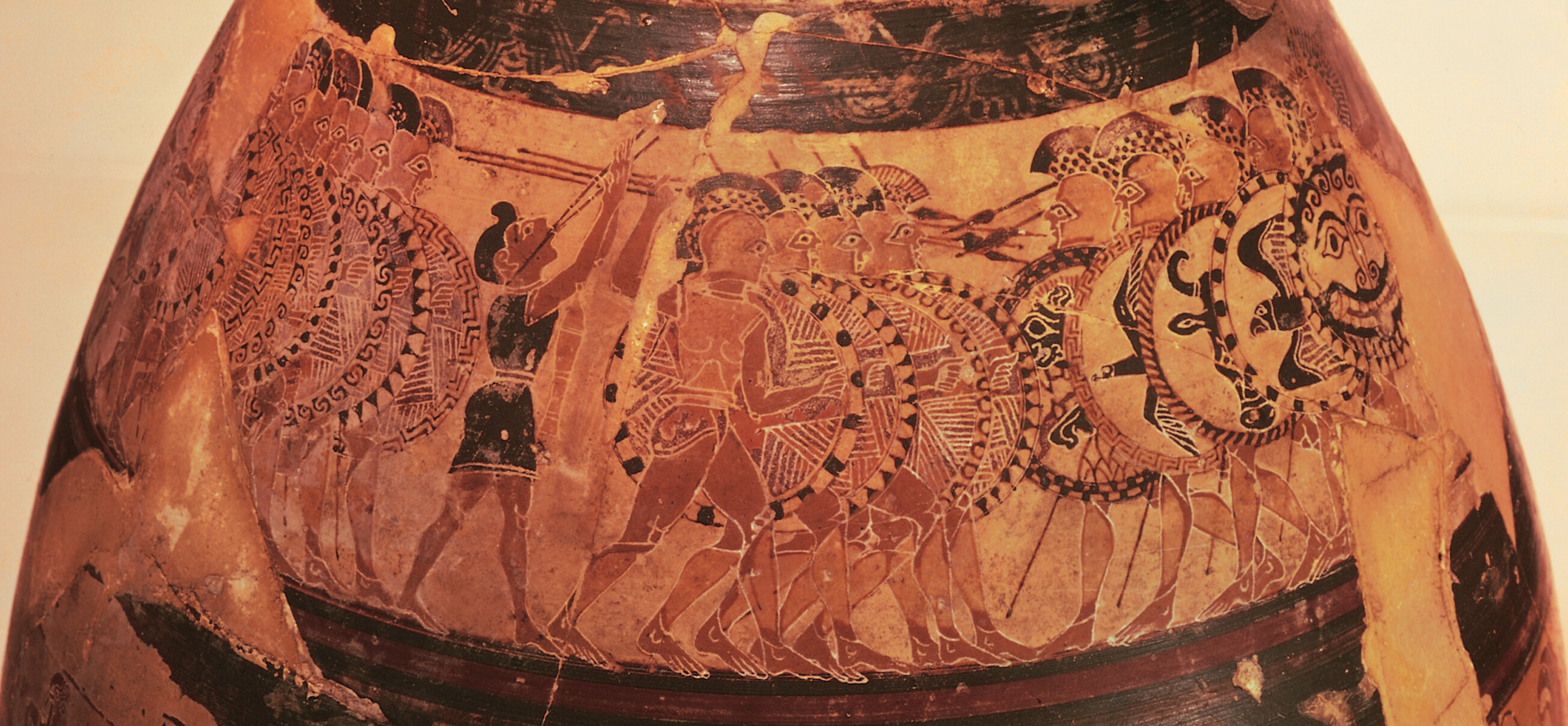 A Corinthian vase, which shows Hoplite infantry advancing into combat. The warriors carry shields and spears.