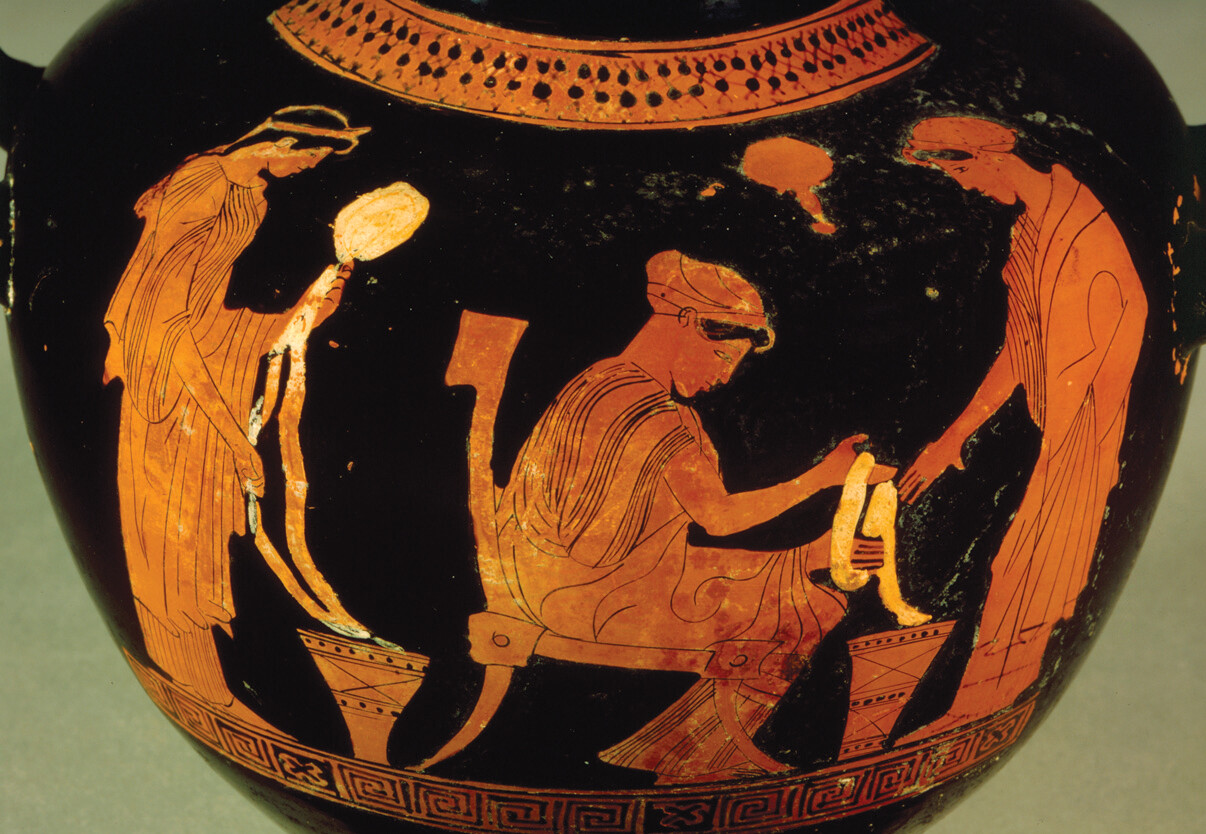 A red-figure vase depicting three women in the process of weaving.