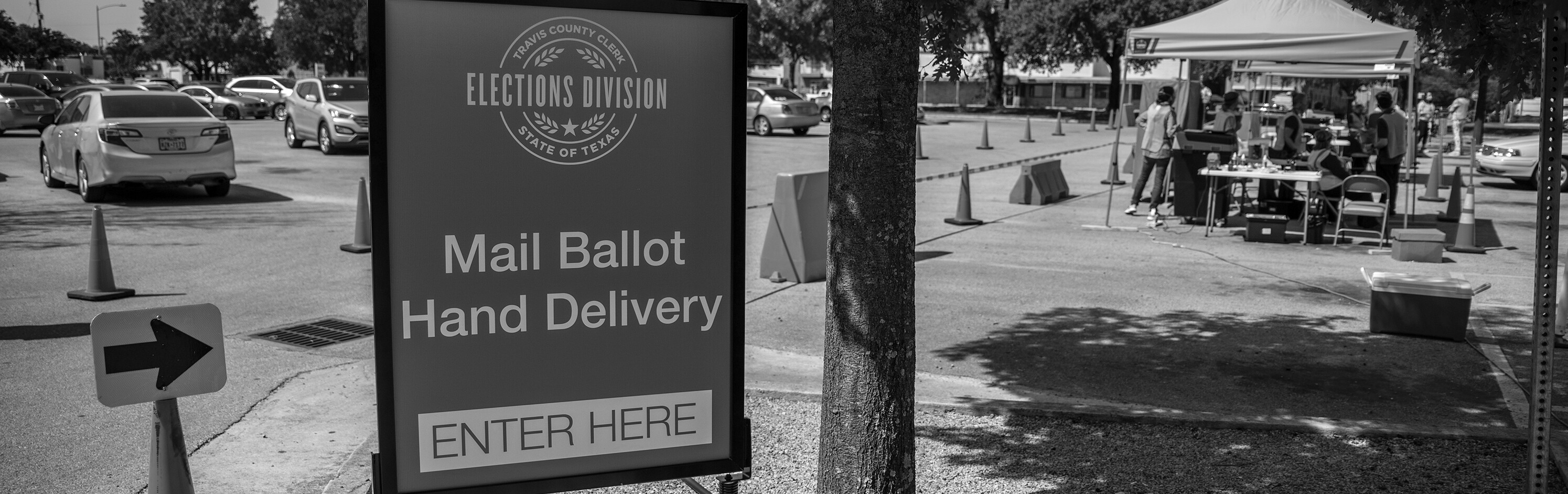 A sign in a parking lot, pertaining to an election.