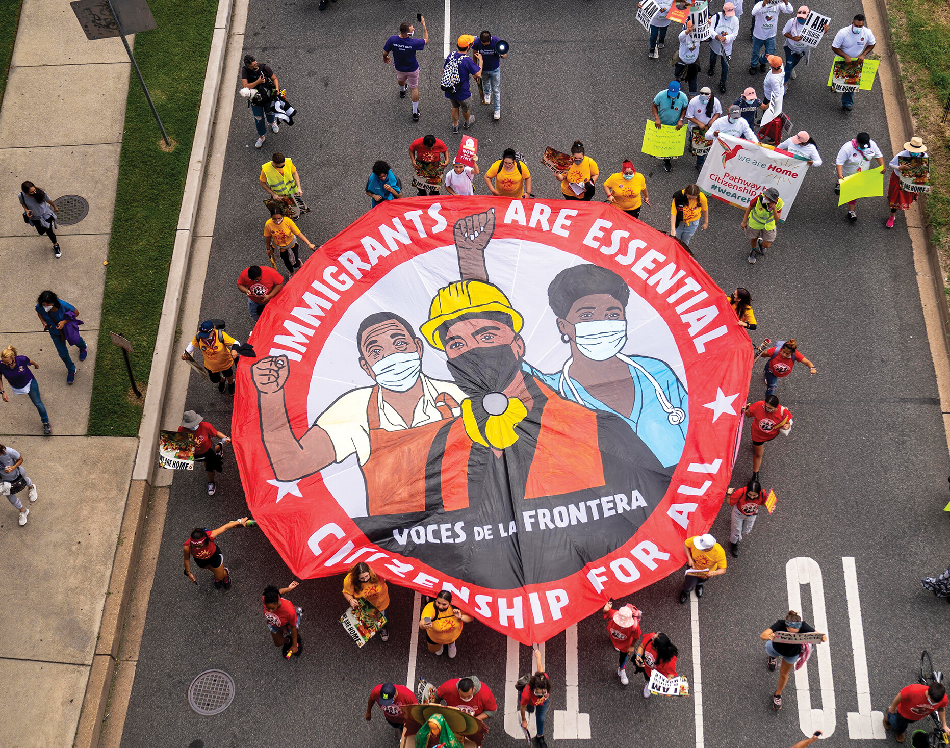 An overhead view of marchers on behalf of the rights of immigrants.
