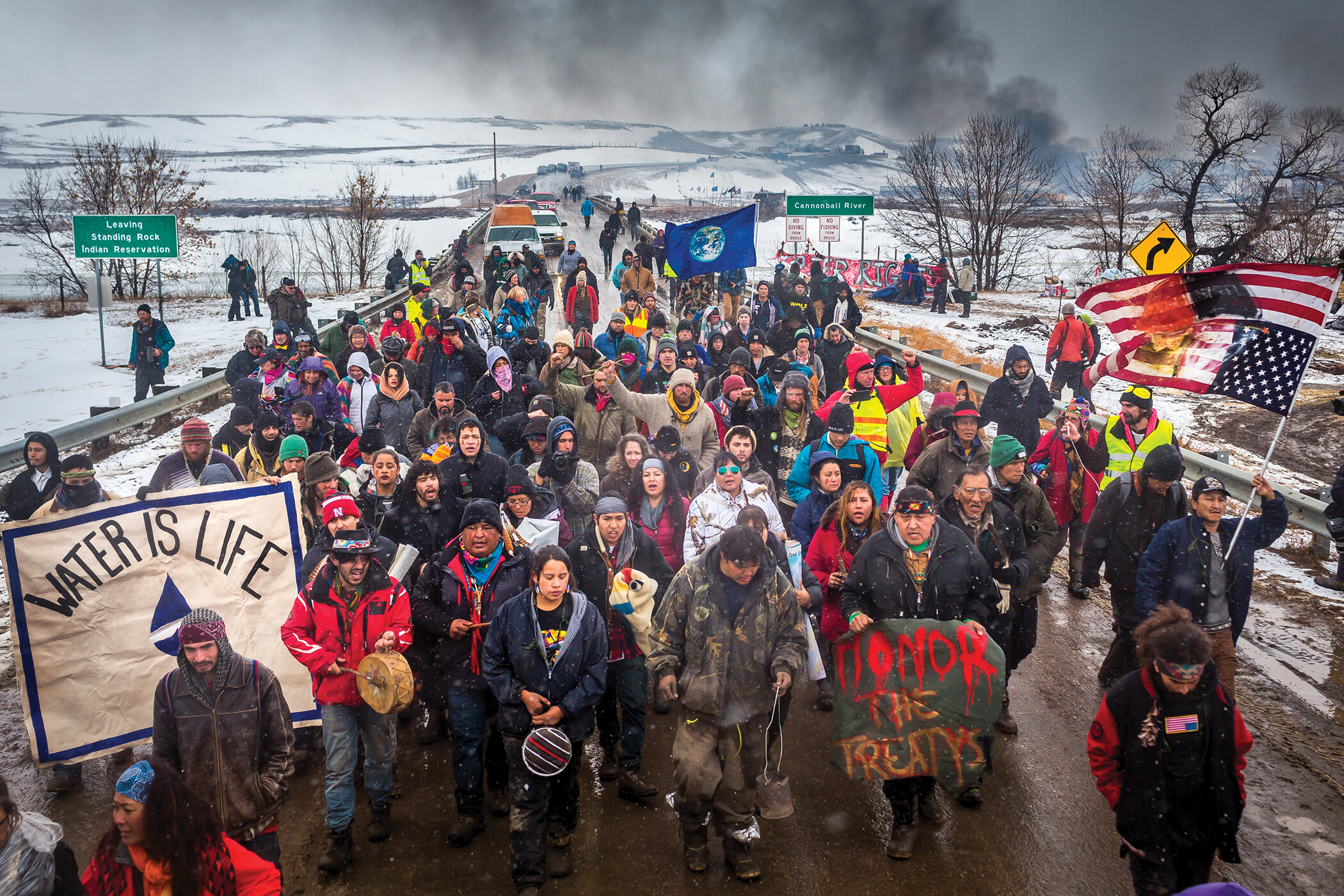 People stand blocking a bridge over the Cannonball River in Southwestern North Dakota.