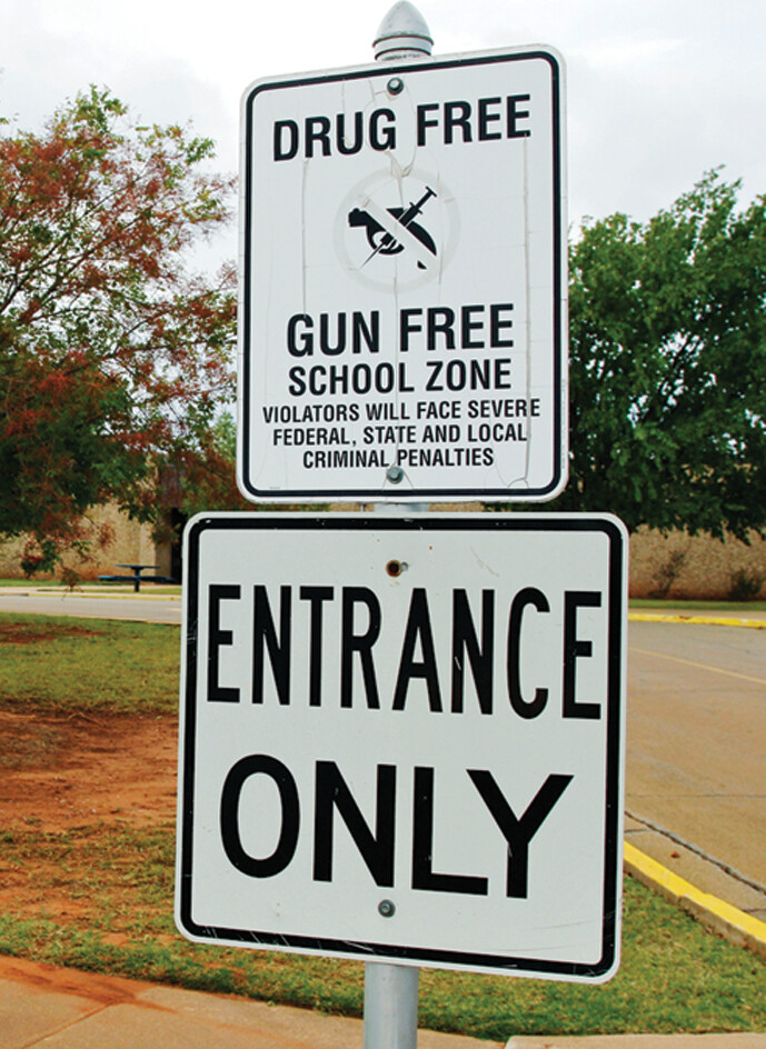 An anti-drug sign posted in front of a school.