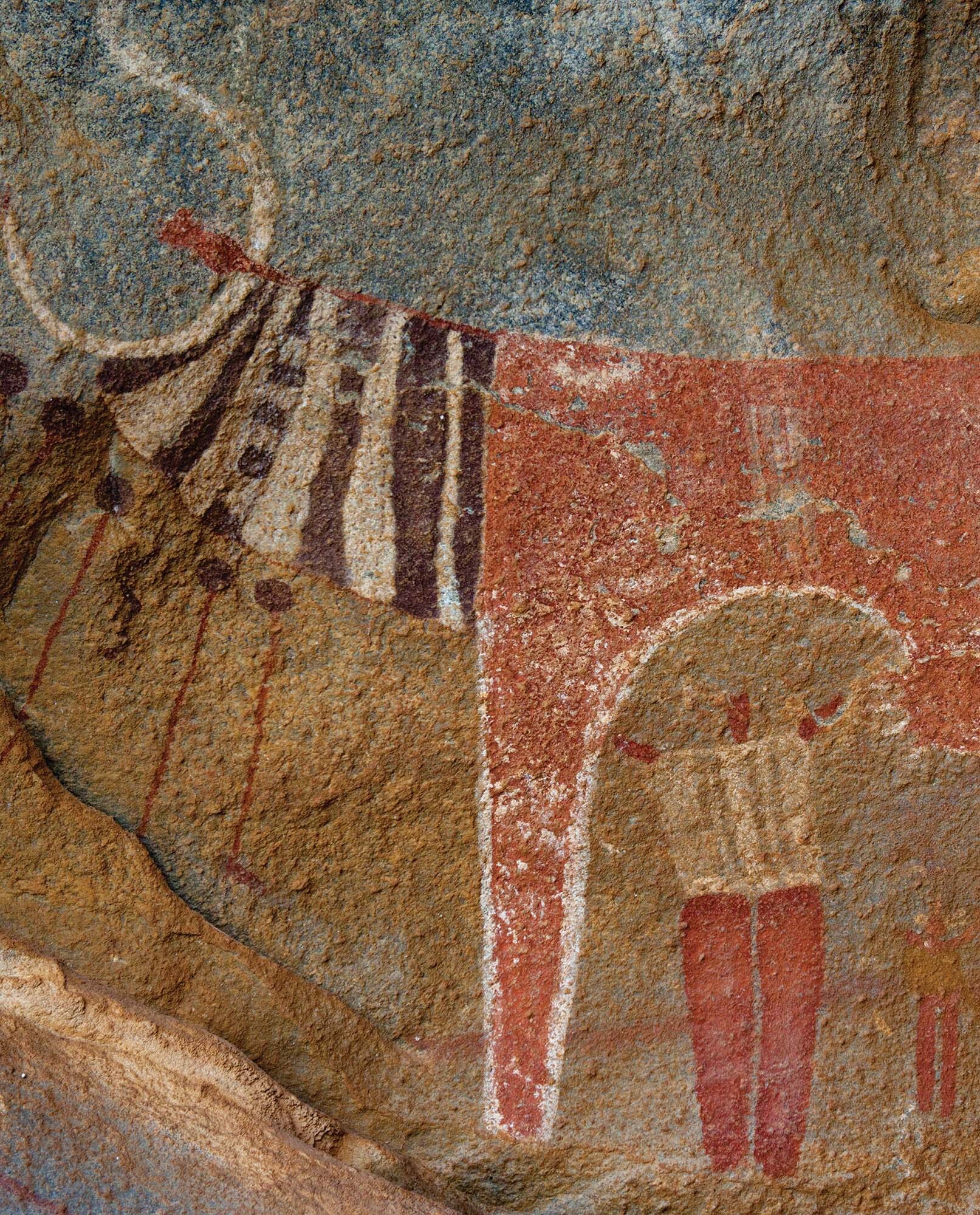 A close-up of a cave painting from Laas Geel. Cattle are depicted with long horns.