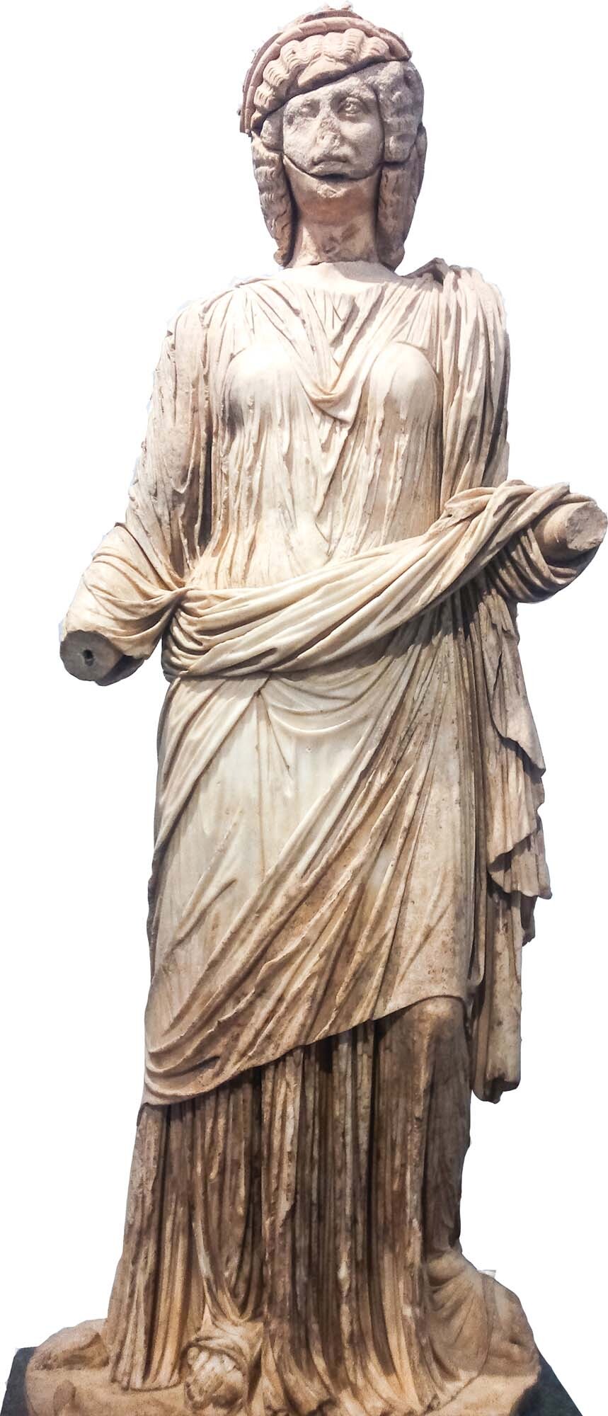 A full-size statue of Claudia Antonia Tatiana of Aphrodisias, a woman with curly hair and a flowing dress.